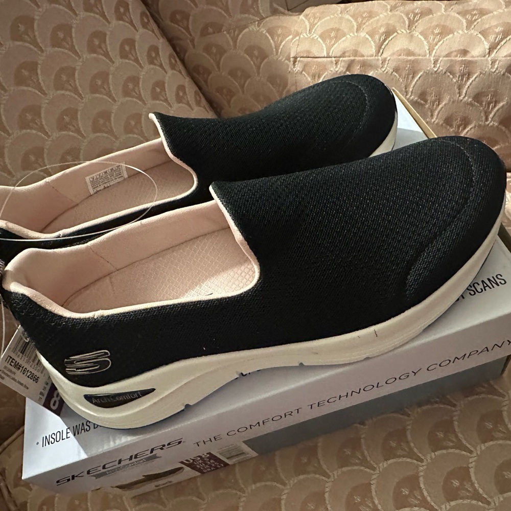Skechers Women's Black and White Slip-On Sneakers